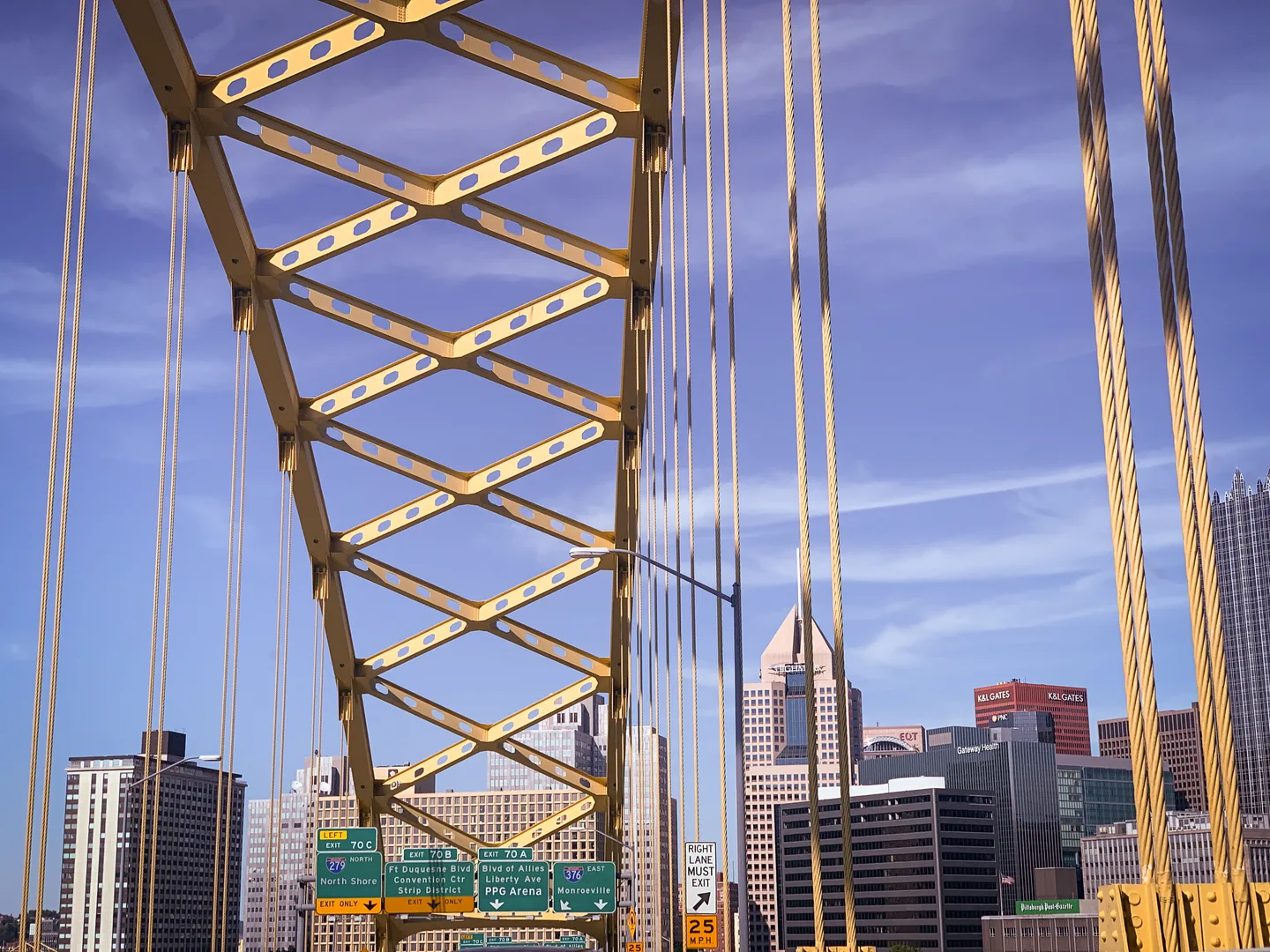 The yellow arches of Fort Pitt Bridge on I-376 approaching downtown Pittsburgh